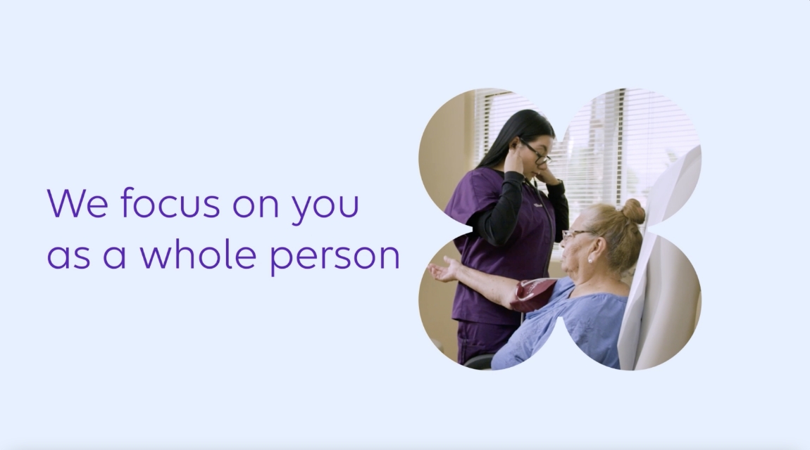 Carelon Health graphic emphasizing whole-person care alongside a clinician supporting a patient during a consultation.